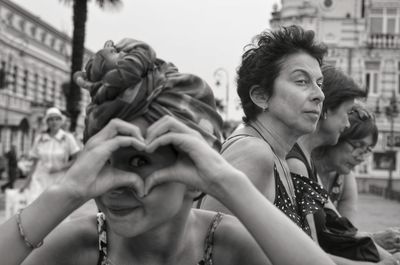 Portrait of friends looking at city