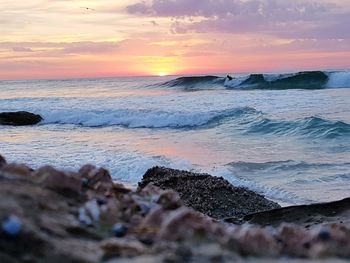 Scenic view of sea against sky during sunset