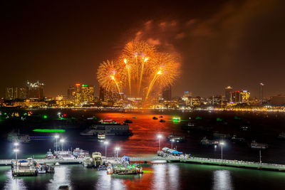 Colorful fireworks display over the night sky of the city during a festival