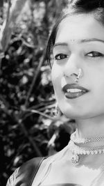 Close-up portrait of a smiling young woman