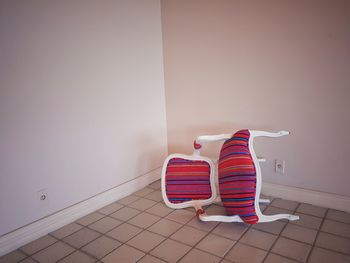 Red toy on chair at home