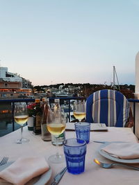 Panoramic shot of beer on table at restaurant against clear sky