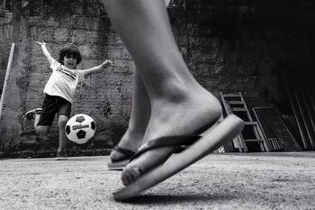 CLOSE-UP OF WOMAN STANDING ON WALL