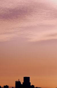 Cityscape against sky during sunset