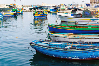 Boats moored at harbor