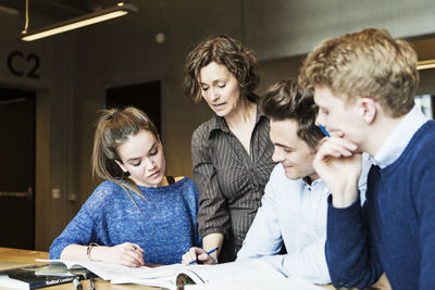 Professor teaching students in classroom