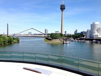 Bridge over river with buildings in background