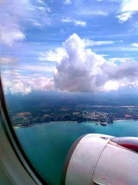 Aerial view of city seen through airplane window