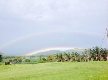 Scenic view of rainbow over mountains