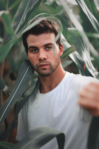 Portrait of man amidst plants