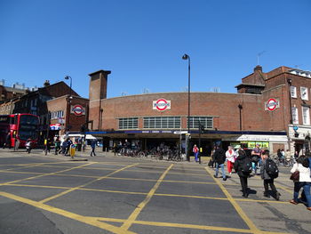 People on road against buildings