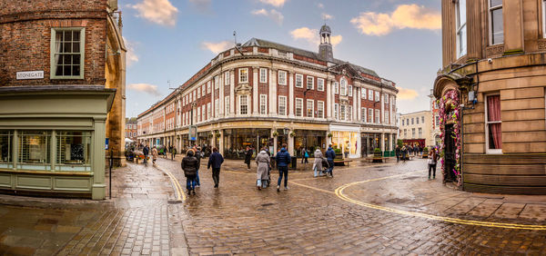 People walking on street in city