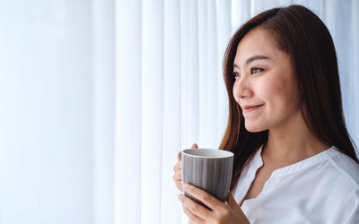 Woman holding coffee cup