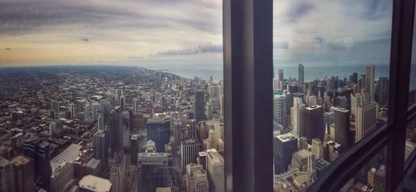 Aerial view of city buildings against sky