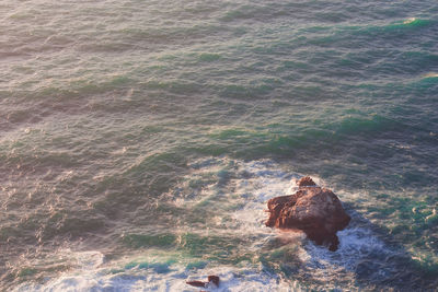 High angle view of rocks in sea