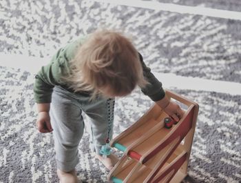 Rear view of girl playing in winter