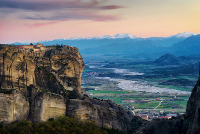 Scenic view of mountain against cloudy sky