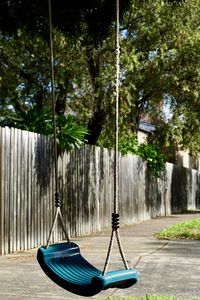 View of playground and trees in park