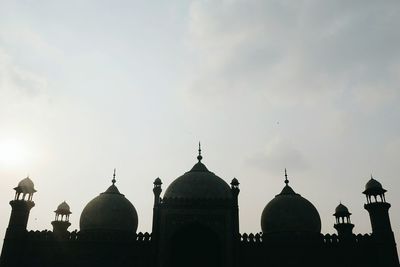 Silhouette of cathedral against sky