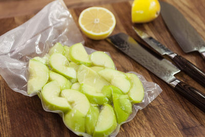 Close-up of vacuum packed apples on table