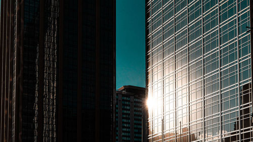 Low angle view of buildings in city against sky