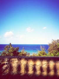 Scenic view of sea against blue sky