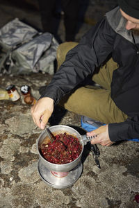High angle view of tourist preparing food