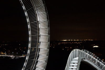 Aerial view of city lit up at night