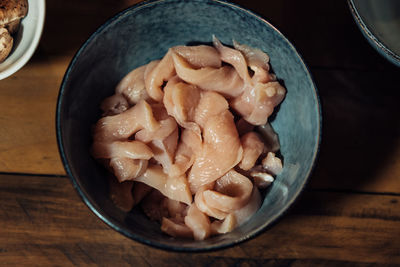 Close-up of pasta in bowl on cutting board