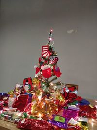 Low angle view of illuminated christmas tree against sky