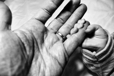 Close-up of man holding hands