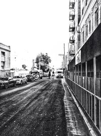 Vehicles on road along buildings