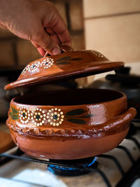 Close-up of hand holding ice cream