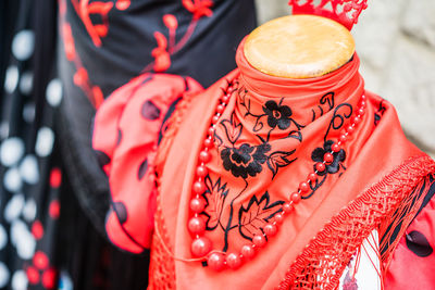 Close-up of garments with jewelry for sale in market