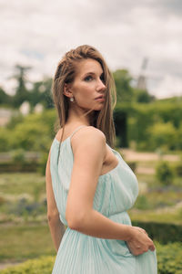 Young woman standing on field