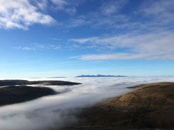 Scenic view of landscape against blue sky