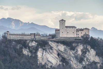 Historic building against cloudy sky