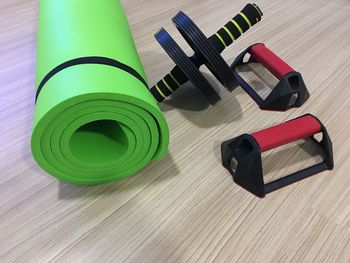 High angle view of gym equipment on hardwood floor