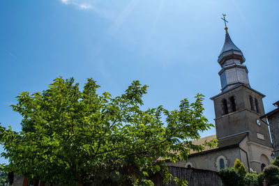 Low angle view of clock tower against sky