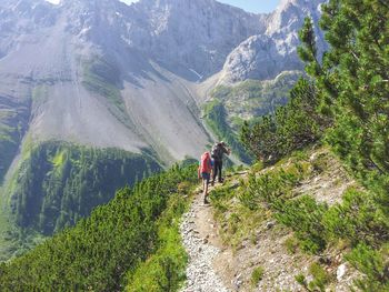 Rear view of people on mountain