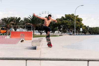 Skateboarder doing a trick in a skate park