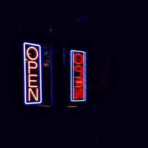Neon sign on white wall