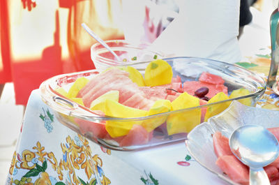 Close-up of fruits in glass bowl on table