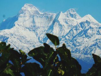 Scenic view of snowcapped mountains against sky
