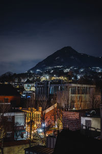 High angle view of illuminated buildings in city at night