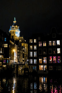 Illuminated buildings in city at night