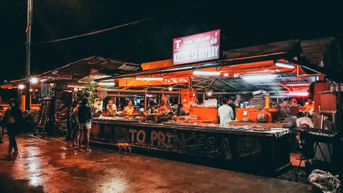 Illuminated market stall at night