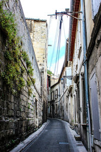 Narrow alley along buildings