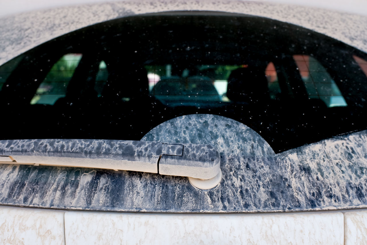 REFLECTION OF CAR ON WINDOW