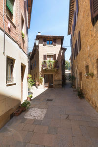 Alley amidst buildings in city